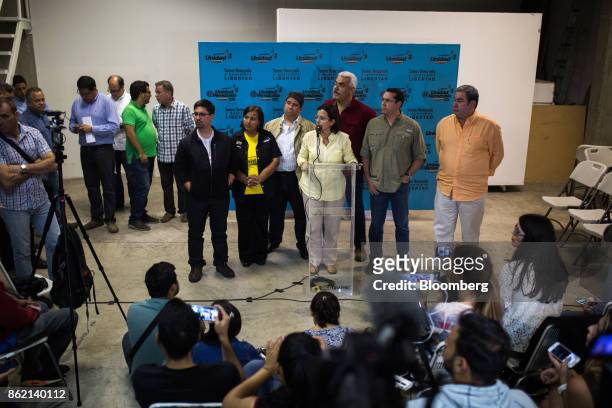Liliana Hernandez, deputy of the National Assembly, center, and members of the Democratic Unity Roundtable opposition party take a question during a...