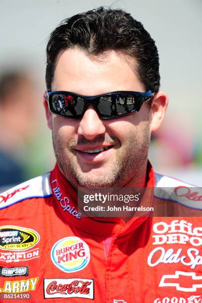 Tony Stewart, driver of the Old Spice Chevrolet, walks down pit road during qualifying for the NASCAR Sprint Cup Series Aaron's 499 at Talladega...