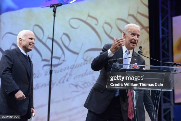 Sen. John McCain receives the the 2017 Liberty Medal from former Vice President Joe Biden at the National Constitution Center on October 16, 2017 in...