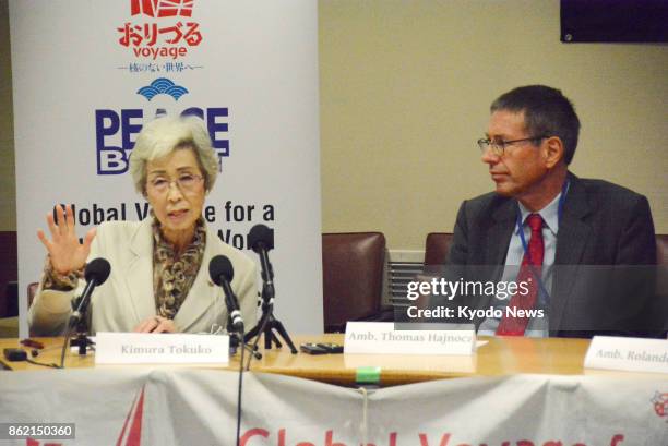 Japanese atomic-bomb survivor Tokuko Kimura shares her experiences at the U.N. Headquarters in New York on Oct. 16 beside Austrian Ambassador to...