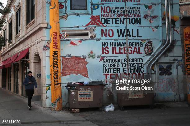 Mural voicing support for immigrants is painted along a retail strip in the predominately Hispanic Pilsen neighborhood on October 16, 2017 in...