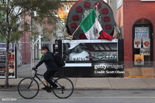 Cyclist rides along a commercial strip in the predominately Hispanic Pilsen neighborhood on October 16, 2017 in Chicago, Illinois. The U.S. Justice...