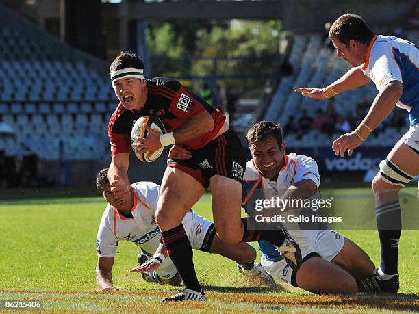 Ryan Crotty of the Crusaders tackled by Kobus Calldo of the Cheetahs during the Super 14 match between Vodacom Cheetahs and Crusaders at Vodacom Park...