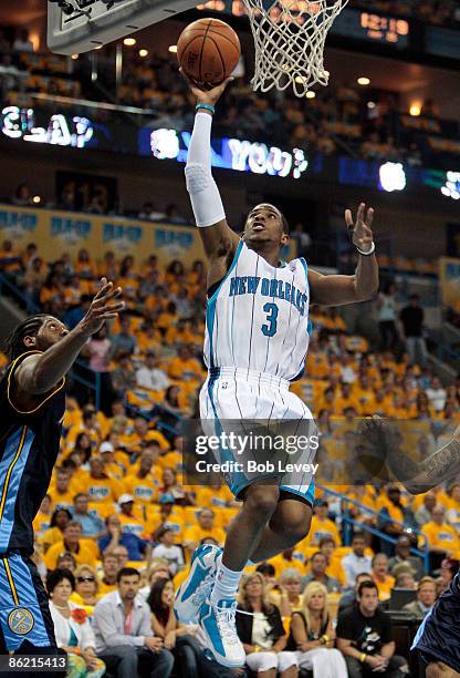 Guard Chris Paul of the New Orleans Hornets drives to the basket in the first quarter against the Denver Nuggets during Game Three of the Western...