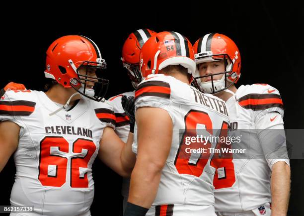 Kevin Hogan of the Cleveland Browns huddles with Chris Barker and Austin Reiter before the game against the Houston Texans at NRG Stadium on October...