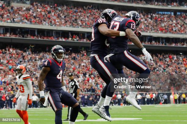 Stephen Anderson of the Houston Texans celebrates with Braxton Miller after a touchdown against the Cleveland Browns in the first half at NRG Stadium...