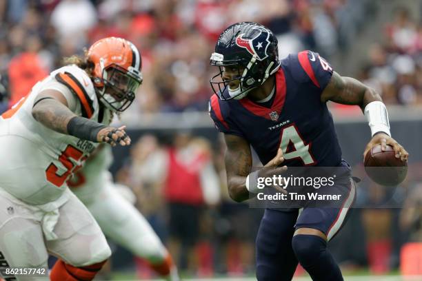 Deshaun Watson of the Houston Texans is forced to scramble pursued by Danny Shelton of the Cleveland Browns in the second quarter at NRG Stadium on...