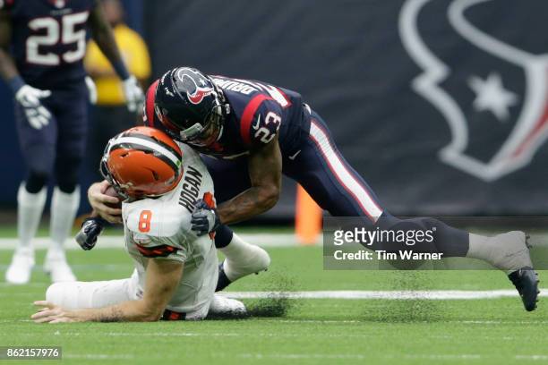 Kurtis Drummond of the Houston Texans tackles Kevin Hogan of the Cleveland Browns in the second half at NRG Stadium on October 15, 2017 in Houston,...