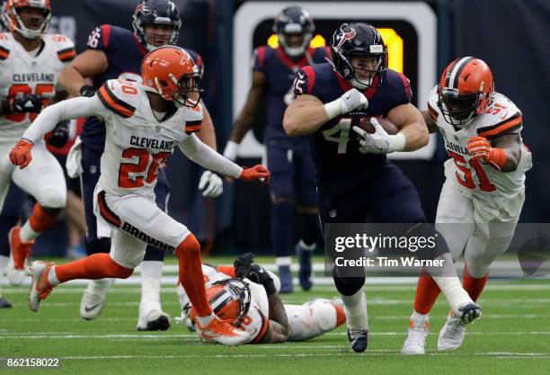 Jay Prosch of the Houston Texans runs after a catch pursued by Jamie Collins of the Cleveland Browns and Brian Boddy-Calhoun in the second half at...