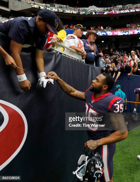 Eddie Pleasant of the Houston Texans signs autographs after the game against the Cleveland Browns at NRG Stadium on October 15, 2017 in Houston,...