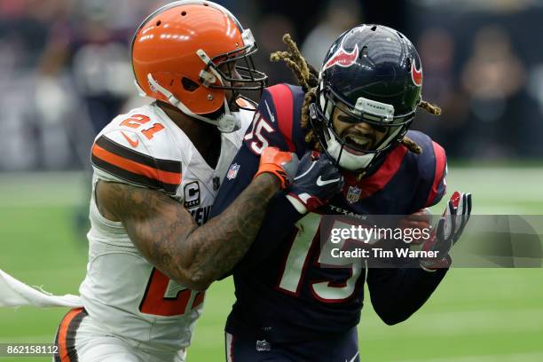 Will Fuller of the Houston Texans reacts after dropping a pass in the second half defended by Jamar Taylor at NRG Stadium on October 15, 2017 in...