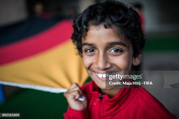 Boy holds a German flag prior the FIFA U-17 World Cup India 2017 Round of 16 match between Columbia and Germany at Jawaharlal Nehru Stadium on...