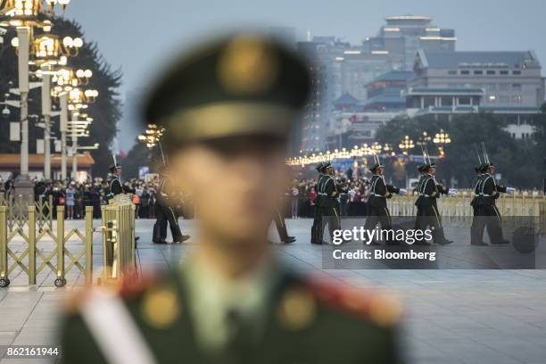 Chinese People's Liberation Army ceremonial guards cross Changan Avenue during a flag lowering ceremony at Tiananmen Square in Beijing, China on...