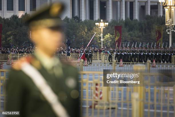 Chinese People's Liberation Army ceremonial guards cross Changan Avenue during a flag lowering ceremony at Tiananmen Square in Beijing, China on...