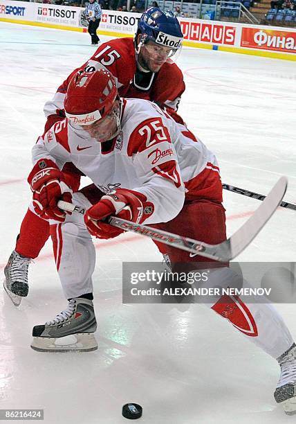 Danish Kasper Pedersen vies with Czech Jan Marek during their preliminary round group D game of the IIHF Internetional Ice Hockey World Championship...