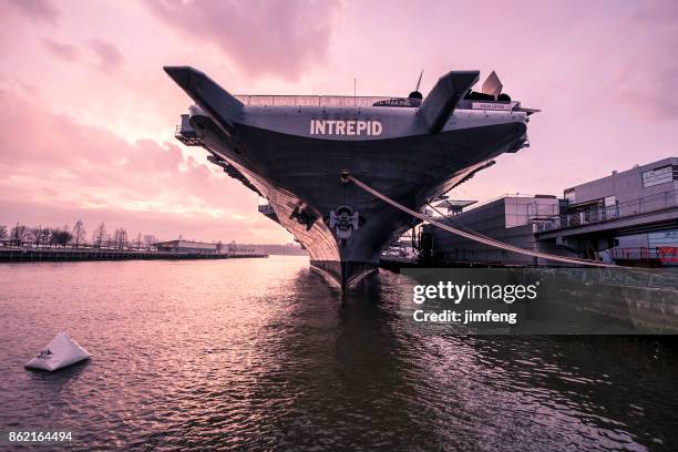 u.s.s. intrepid in dusk - uss intrepid stock pictures, royalty-free photos & images