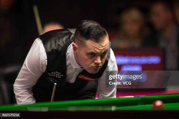 Elliot Slessor of England reacts during his first round match against John Higgins of Scotland on day one of 2017 Dafabet English Open at Barnsley...
