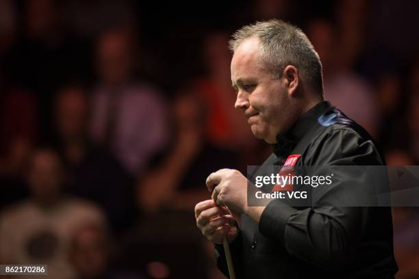 John Higgins of Scotland reacts during his first round match against Elliot Slessor of England on day one of 2017 Dafabet English Open at Barnsley...