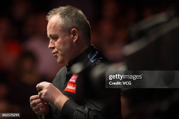 John Higgins of Scotland reacts during his first round match against Elliot Slessor of England on day one of 2017 Dafabet English Open at Barnsley...