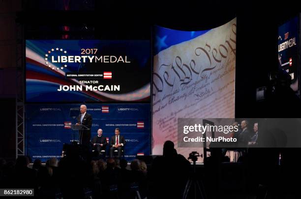 Senator John McCain receives the 2017 Liberty Medal out of hands of former VP Joe Biden, during October 16, 2017 a ceremony at the Constitution...