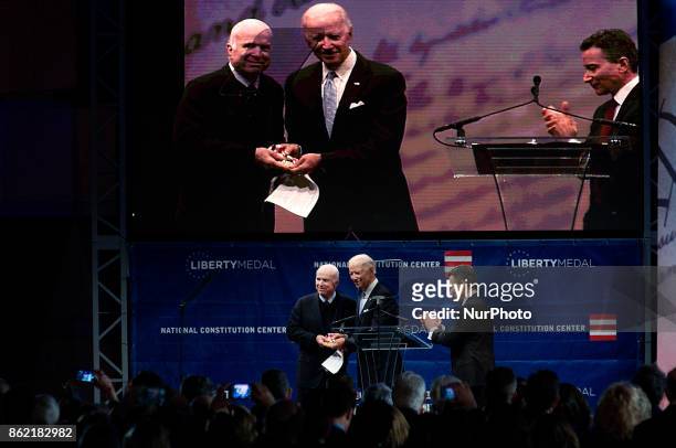 Senator John McCain receives the 2017 Liberty Medal out of hands of former VP Joe Biden, during October 16, 2017 a ceremony at the Constitution...