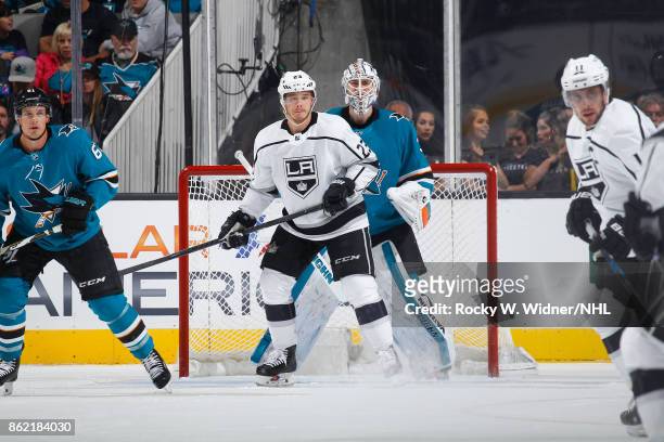 Martin Jones of the San Jose Sharks defends the net against Dustin Brown of the Los Angeles Kings at SAP Center on October 7, 2017 in San Jose,...