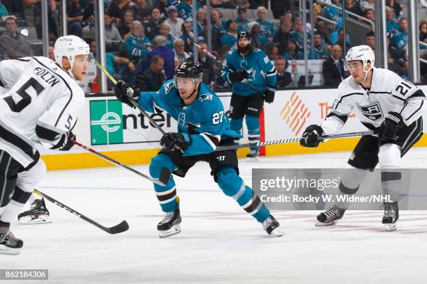 Joonas Donskoi of the San Jose Sharks is defended by Nick Shore of the Los Angeles Kings at SAP Center on October 7, 2017 in San Jose, California.