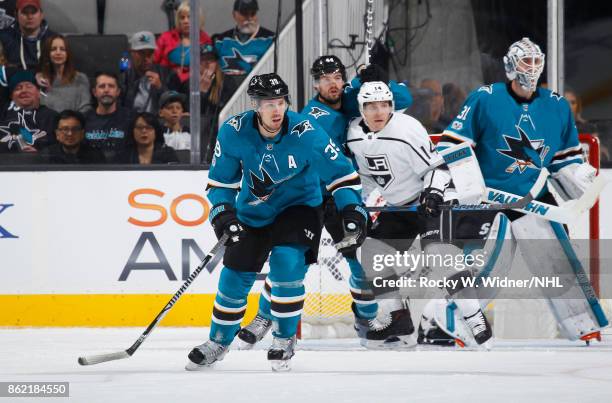 Logan Couture, Marc-Edouard Vlasic and Martin Jones of the San Jose Sharks defend against Michael Cammalleri of the Los Angeles Kings at SAP Center...