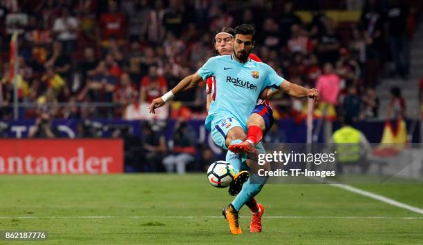 Filipe Luis of Atletico Madrid and Andre Gomes of Barcelona battle for the ball during the La Liga match between Club Atletico Madrid and FC...