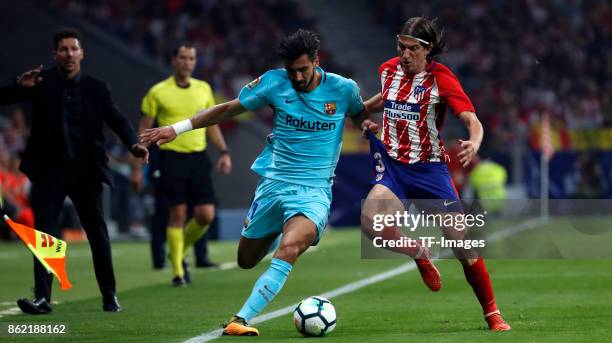 Filipe Luis of Atletico Madrid and Andre Gomes battle for the ball during the La Liga match between Club Atletico Madrid and FC Barcelona at Estadio...