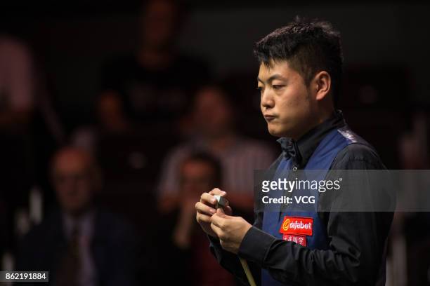 Liang Wenbo of China reacts during his first round match against Duane Jones of Wales on day one of 2017 Dafabet English Open at Barnsley Metrodome...