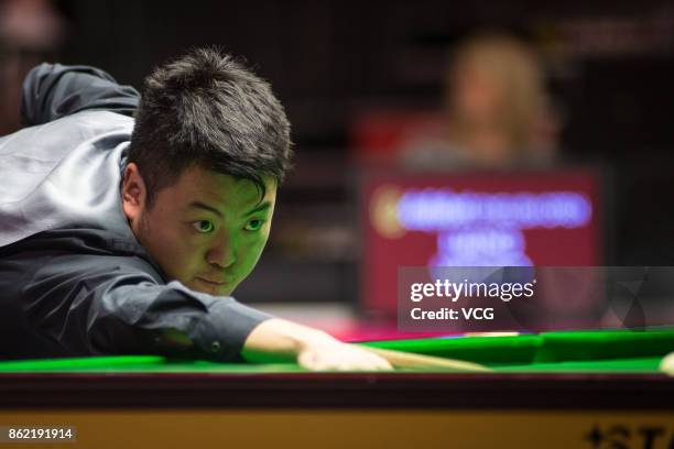 Liang Wenbo of China plays a shot during his first round match against Duane Jones of Wales on day one of 2017 Dafabet English Open at Barnsley...