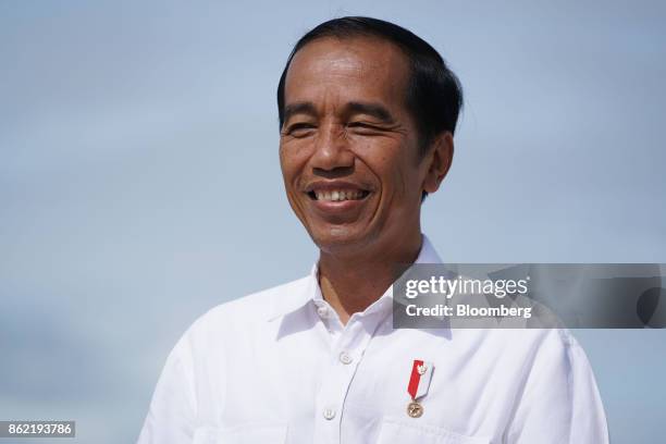 Joko Widodo, Indonesia's president, smiles during a Bloomberg Television interview in Silangit, North Sumatra, Indonesia, on Saturday, Oct. 14, 2017....