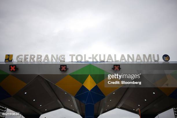 The Kualanamu toll collection gate for the Medan-Kualanamu-Tebing Tinggi toll road stands in Medan, North Sumatra, Indonesia, on Friday, Oct 13,...