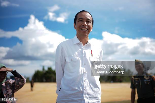 Joko Widodo, Indonesia's president, stands ahead of a Bloomberg Television interview in Silangit, North Sumatra, Indonesia, on Saturday, Oct. 14,...