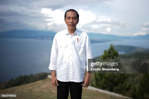 Joko Widodo, Indonesia's president, poses for a photograph in front of Lake Toba ahead of a Bloomberg Television interview in Silangit, North...