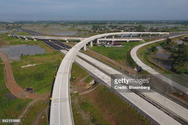 Section of the Medan-Kualanamu-Tebing Tinggi toll road is seen in this aerial photograph taken in Medan, North Sumatra, Indonesia, on Friday, Oct 13,...
