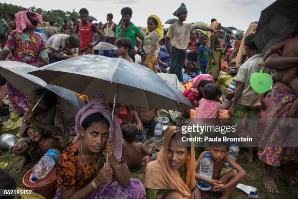 Thousands of Rohingya refugees flee from Myanmar are kept under a tight security by Bangladeshi military after crossing the border in a rice patty...