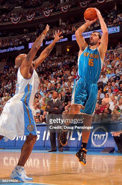 Peja Stojakovic of the New Orleans Hornets takes a shot over Anthony Carter of the Denver Nuggets in Game Two of the Western Conference Quarterfinals...