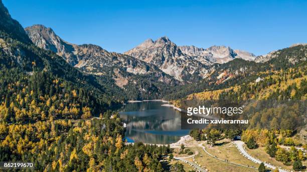 autumn in sant maurici lake, pyrenees, catalonia, spain - catalonia stock pictures, royalty-free photos & images