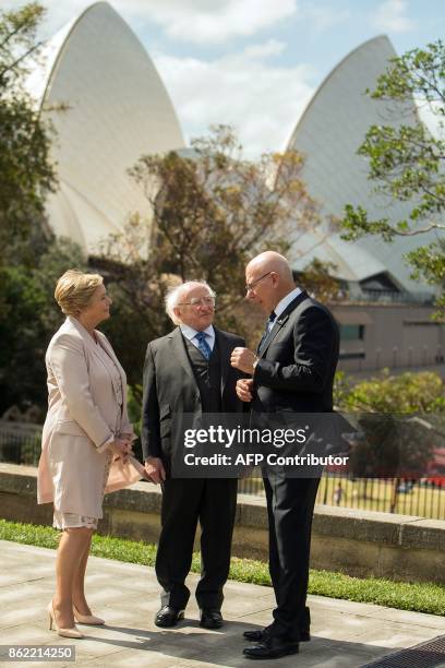 Ireland's President Michael Higgins talks with New South Wales' Governor David Hurley as they walk in the garden with Ireland's Deputy Prime Minister...