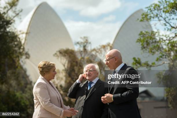 Ireland's President Michael Higgins talks with New South Wales' Governor David Hurley as they walk in the garden with Ireland's Deputy Prime Minister...