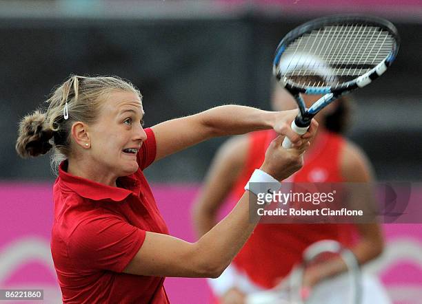 Mateja Kraljeric of Switzerland returns a shot in the doubles match against Rennae Stubbs and Jelena Dokic of Australia during the Federation Cup...