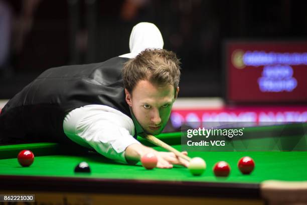 Judd Trump of England plays a shot during his first round match against Robbie Williams of England on day one of 2017 Dafabet English Open at...