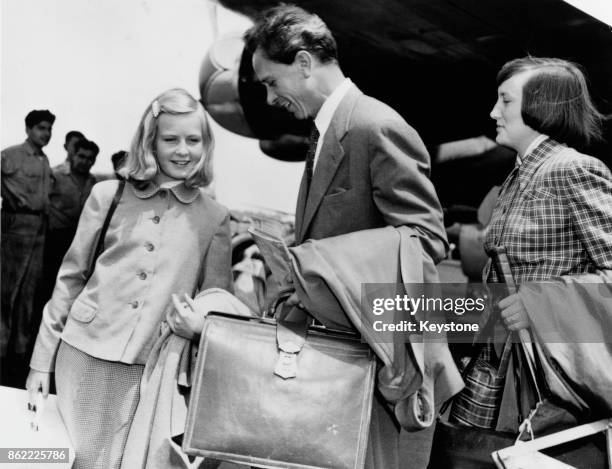 Dr Petter Lindstrom, the first husband of actress Ingrid Bergman, arrives at Los Angeles Airport with their daughter Pia Lindstrom and his friend Kay...