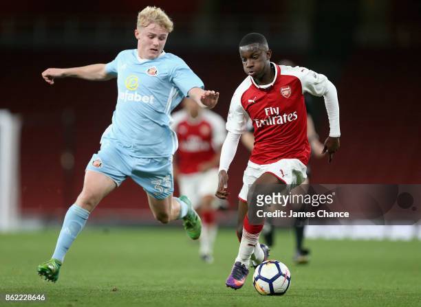Denver Hume of Sunderland and Eddie Nketiah of Arsenal battle for possession during the Premier League 2 match between Arsenal and Sunderland at...