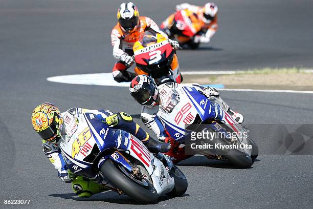 Valentino Rossi of Italy and Fiat Yamaha Team in action with Jorge Lorenzo of Spain and Fiat Yamaha Team, Dani Pedrosa of Spain and Repsol Honda Team...