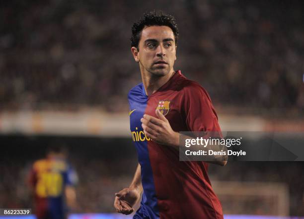 Xavi Hernandez of Barcelona runs over to take a corner kick during the La Liga match between Valencia and Barcelona at the Mestalla stadium on April...