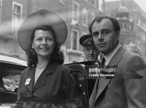American actress Rita Hayworth and her husband Prince Aly Khan leave the Ritz Hotel in London for Ascot, 15th June 1949.