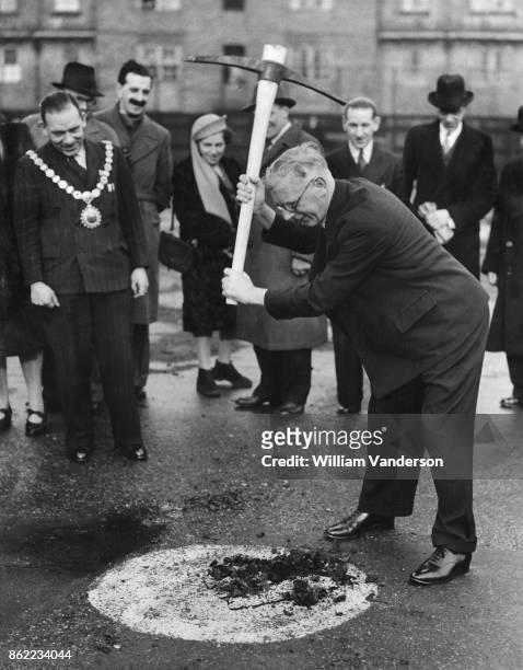 Isaac Hayward , Leader of the London County Council, begins work on the war-damaged foundations of Redriff School on Rotherhithe Street, Bermondsey,...